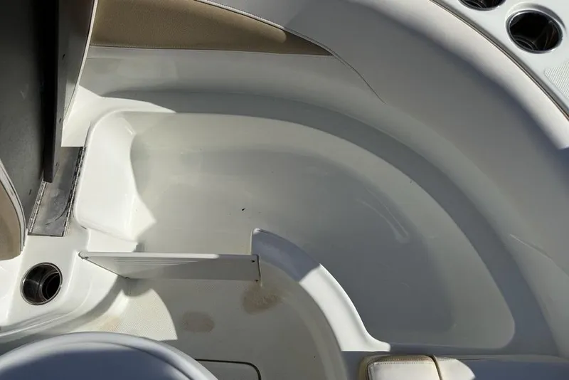 Slide: The Image of Interior view of a 2014 SouthWind 212sd boat, showcasing seating and cup holders. - 5