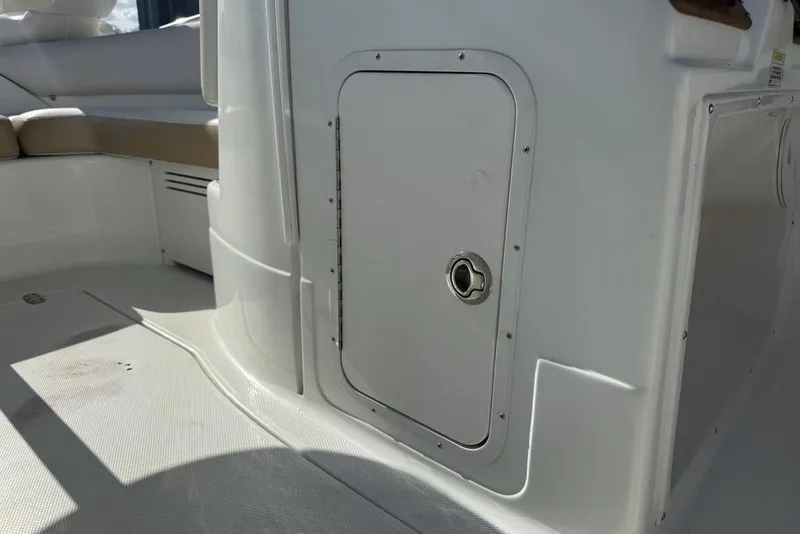 Slide: The Image of 2014 SouthWind 212sd boat interior with storage compartment and seating area. - 8