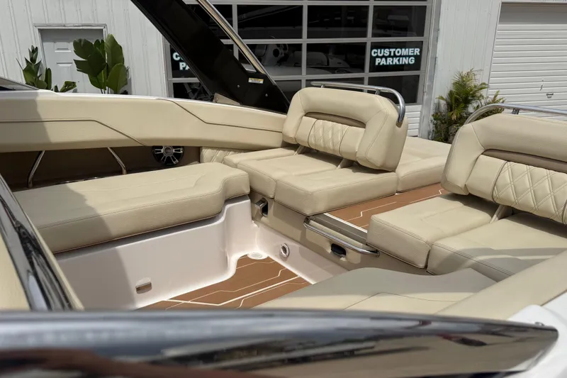 Slide: The Image of Luxurious interior of a 2019 Regal LS4 boat with beige seating and wood accents. - 10