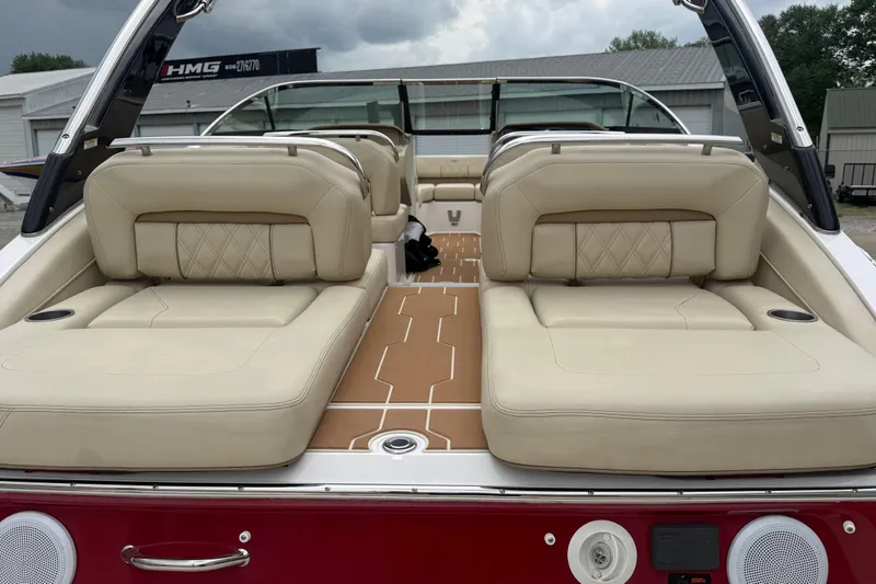 Slide: The Image of 2019 Regal LS4 boat with beige leather seating and sleek design. - 3