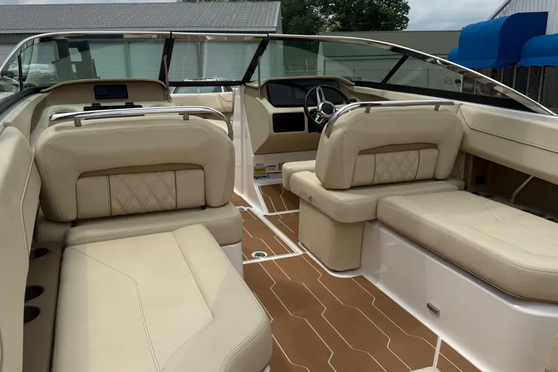 Slide: The Image of Luxurious interior of a 2019 Regal LS4 boat with beige seating and sleek design. - 7