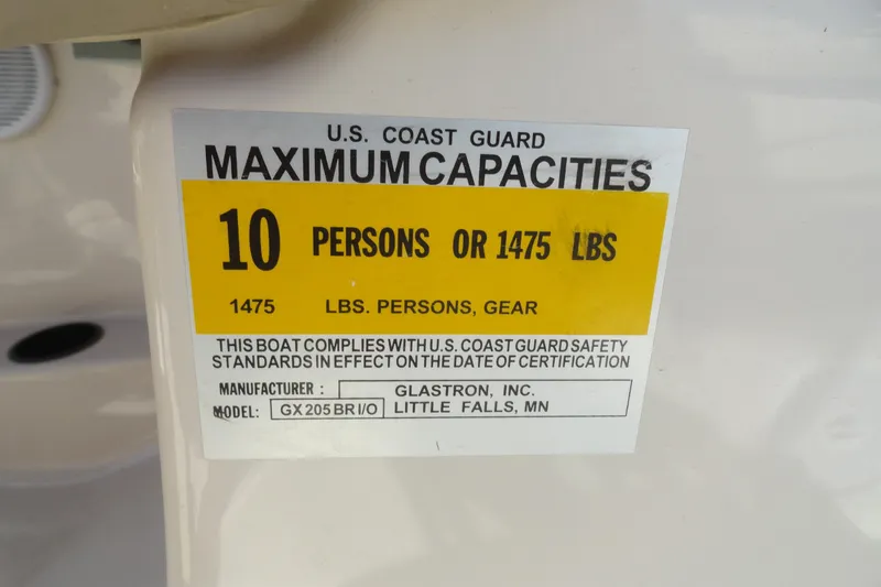 Slide: The Image of U.S. Coast Guard capacity label for 2004 Glastron GX 205 Ski & Fish boat. - 12