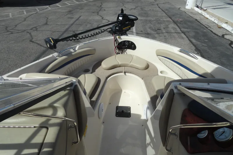 Slide: The Image of 2004 Glastron GX 205 Ski & Fish boat interior with seating and trolling motor. - 15