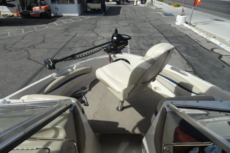 Slide: The Image of 2004 Glastron GX 205 Ski & Fish boat interior with seating and trolling motor. - 16