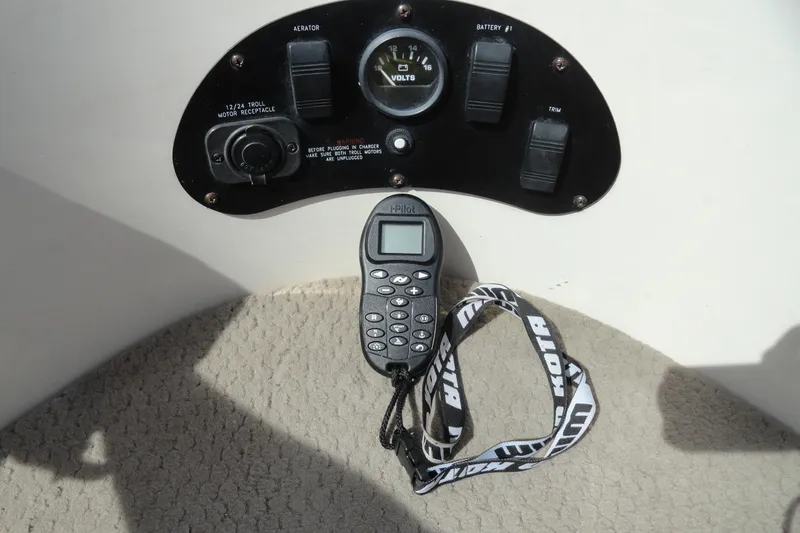 Slide: The Image of Control panel of a 2004 Glastron GX 205 Ski & Fish boat with remote and voltmeter. - 19