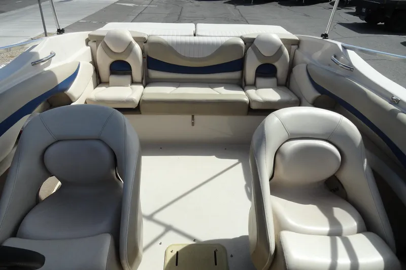 Slide: The Image of 2004 Glastron GX 205 Ski & Fish boat interior with beige seating and blue accents. - 20