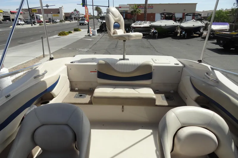 Slide: The Image of 2004 Glastron GX 205 Ski & Fish boat interior with seating and fishing chair. - 21