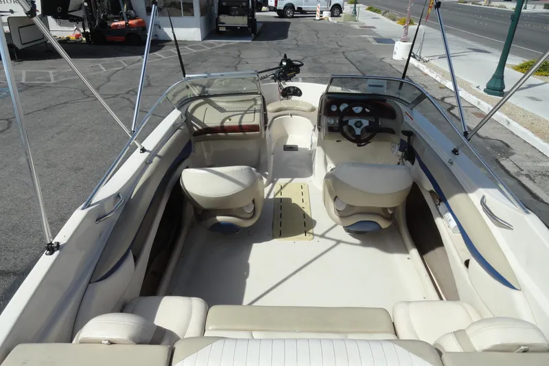 Slide: The Image of 2004 Glastron GX 205 Ski & Fish boat interior with seating and steering wheel. - 6