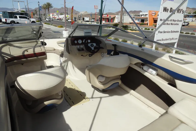 Slide: The Image of 2004 Glastron GX 205 Ski & Fish boat interior with seating and dashboard view. - 7