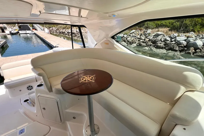 Slide: The Image of Luxurious interior of 2008 Tiara Yachts 3500 Sovran with elegant seating and table. - 14