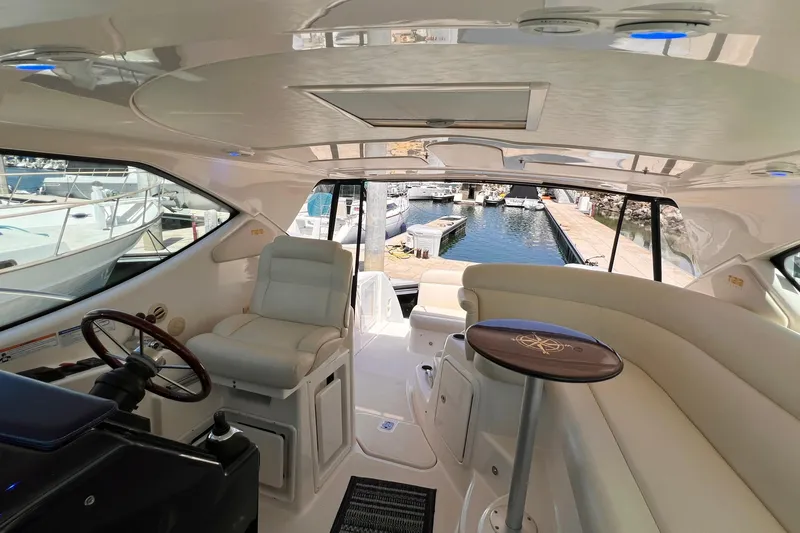 Slide: The Image of Luxurious interior of a 2008 Tiara Yachts 3500 Sovran, featuring plush seating and elegant design. - 16