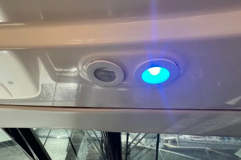 Slide: The Image of 2008 Tiara Yachts 3500 Sovran with illuminated blue light detail. - 18