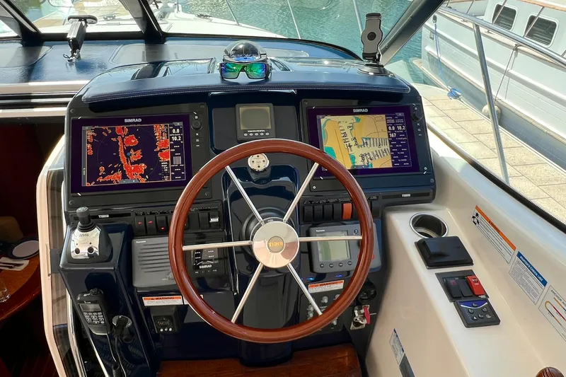 Slide: The Image of 2008 Tiara Yachts 3500 Sovran helm with navigation displays and controls. - 24