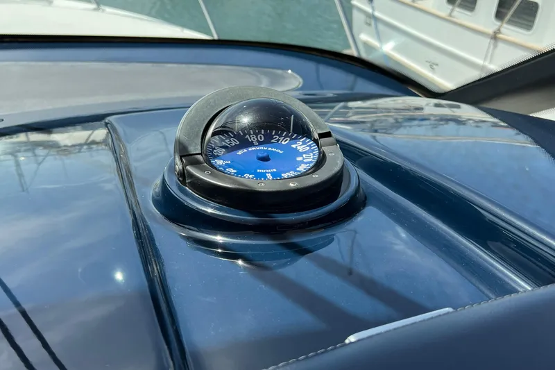 Slide: The Image of Compass on 2008 Tiara Yachts 3500 Sovran dashboard, reflecting sunlight. - 25