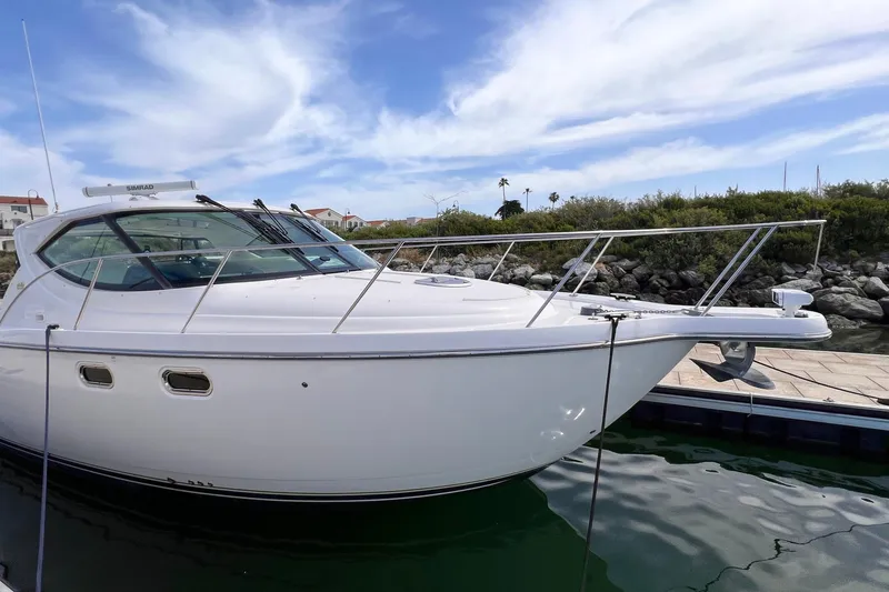 Slide: The Image of 2008 Tiara Yachts 3500 Sovran docked, showcasing sleek design and modern features. - 3