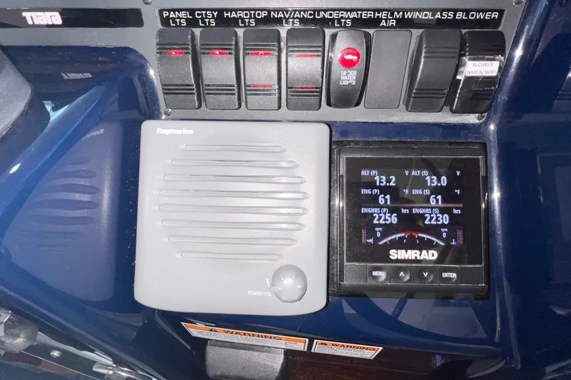 Slide: The Image of Control panel of a 2008 Tiara Yachts 3500 Sovran with Raymarine and Simrad displays. - 30