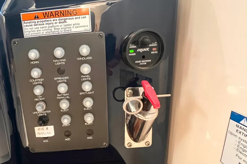 Slide: The Image of Control panel of a 2008 Tiara Yachts 3500 Sovran with warning label and switches. - 31