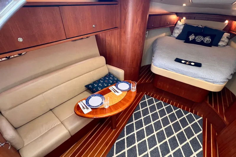 Slide: The Image of Luxurious interior of 2008 Tiara Yachts 3500 Sovran with cozy seating and elegant dining setup. - 36