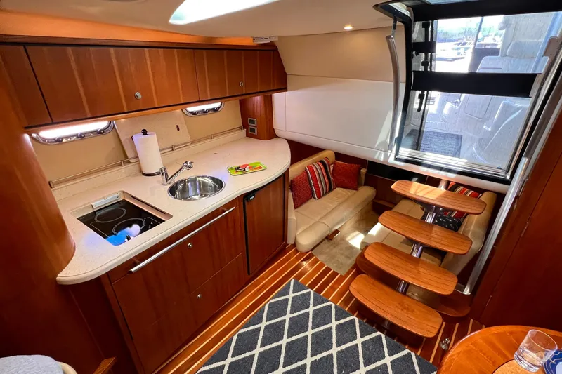 Slide: The Image of Luxurious 2008 Tiara Yachts 3500 Sovran interior with kitchenette and seating area. - 38
