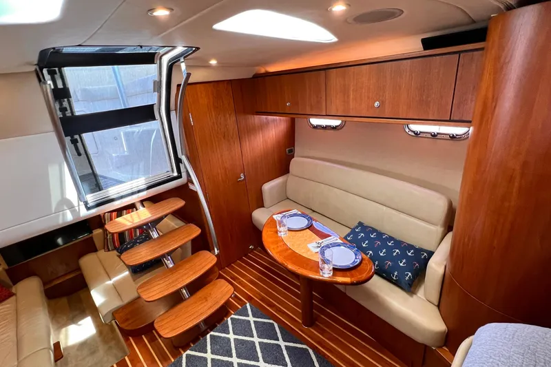 Slide: The Image of Luxurious interior of 2008 Tiara Yachts 3500 Sovran with elegant wood finishes and cozy seating. - 40