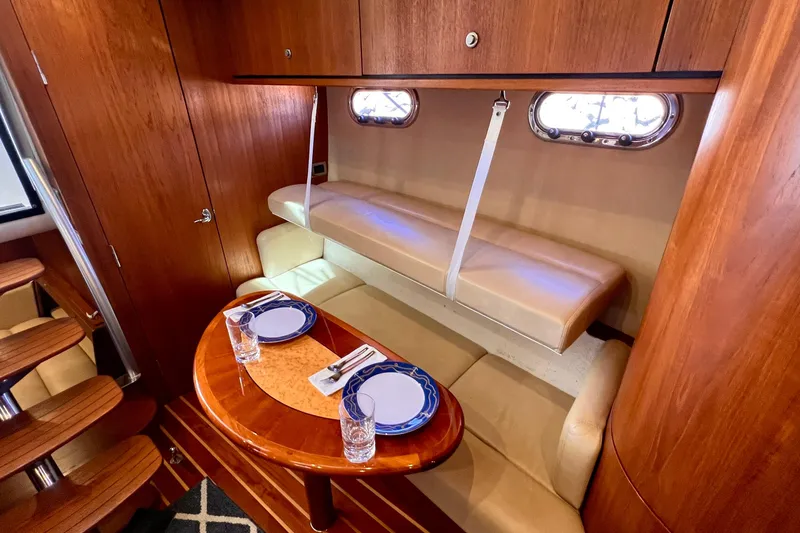 Slide: The Image of Luxurious 2008 Tiara Yachts 3500 Sovran interior with elegant dining area and wooden finishes. - 41