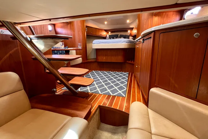 Slide: The Image of Luxurious interior of 2008 Tiara Yachts 3500 Sovran with wood finishes and cozy seating. - 46