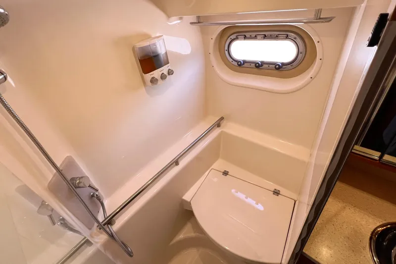 Slide: The Image of Bathroom interior of 2008 Tiara Yachts 3500 Sovran with porthole and shower amenities. - 50