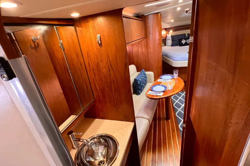 Slide: The Image of Luxurious 2008 Tiara Yachts 3500 Sovran interior with elegant wood finish and cozy dining area. - 51