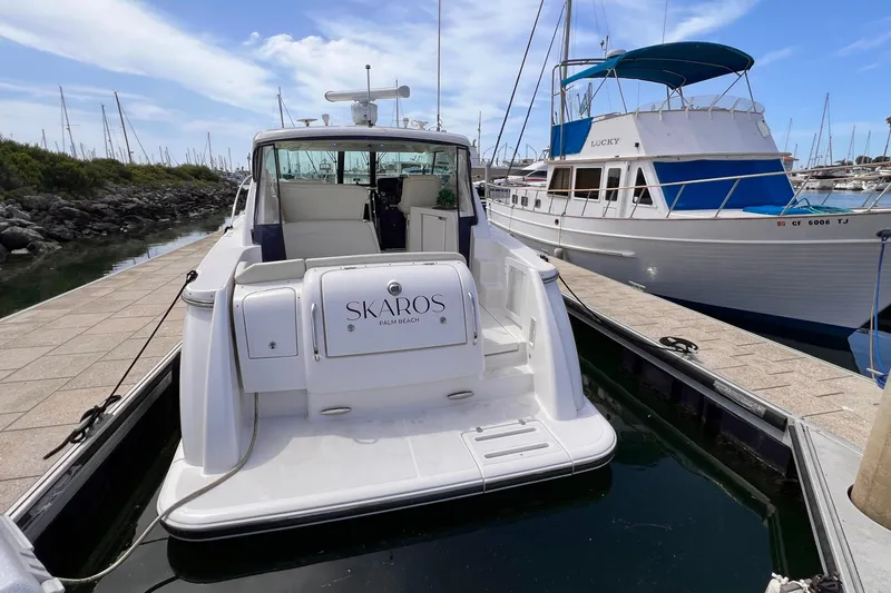 Slide: The Image of 2008 Tiara Yachts 3500 Sovran docked at marina, rear view with neighboring boat. - 7