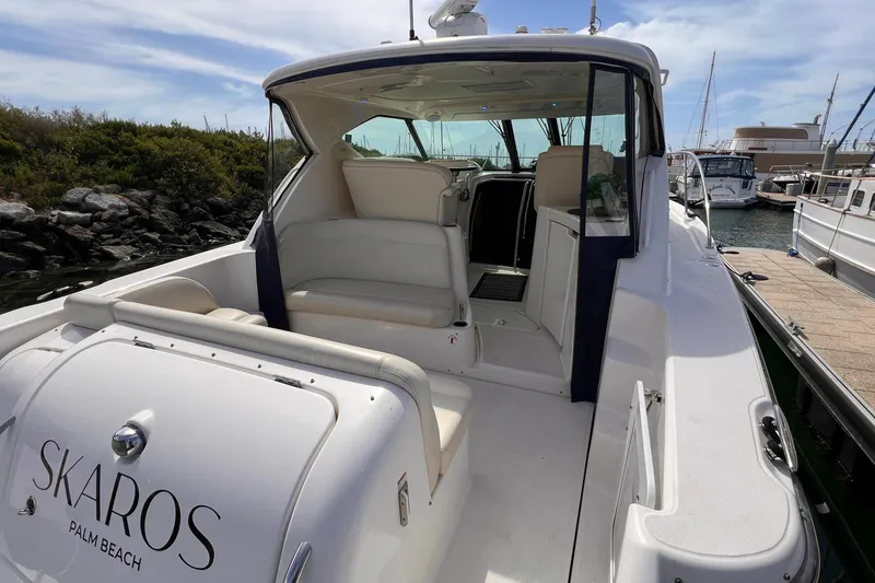 Slide: The Image of 2008 Tiara Yachts 3500 Sovran docked, featuring spacious seating and sleek design. - 8