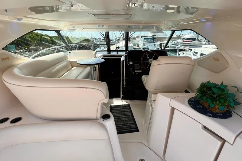 Slide: The Image of Luxurious interior of 2008 Tiara Yachts 3500 Sovran with plush seating and helm. - 9