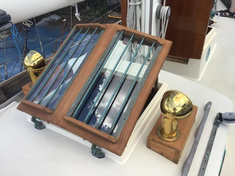 Slide: The Image of Bristol Channel Cutter 28, 2006, featuring wooden hatch and brass fittings. - 13