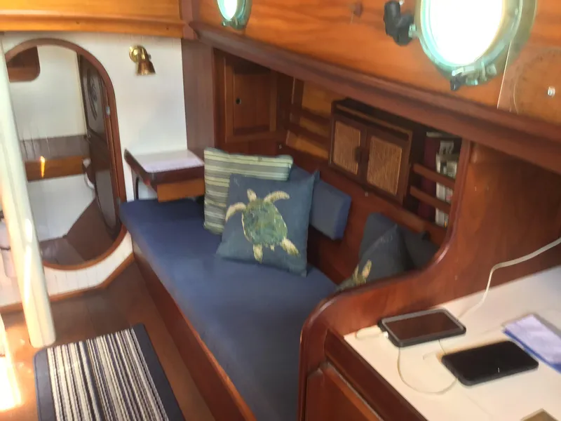 Slide: The Image of Interior of a 2006 Bristol Channel Cutter 28 with cozy seating area. - 31