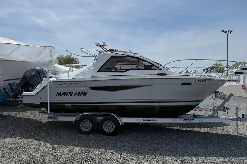 The Image of 2024 Solara S-250 Coupe boat on trailer, side view, outdoors. - 1