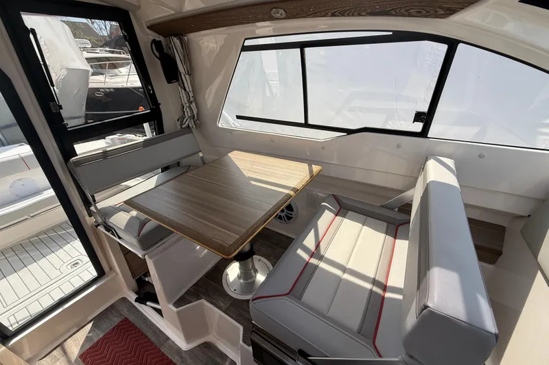 Slide: The Image of Interior of 2024 Solara S-250 Coupe, featuring a stylish dining area with wood table. - 10