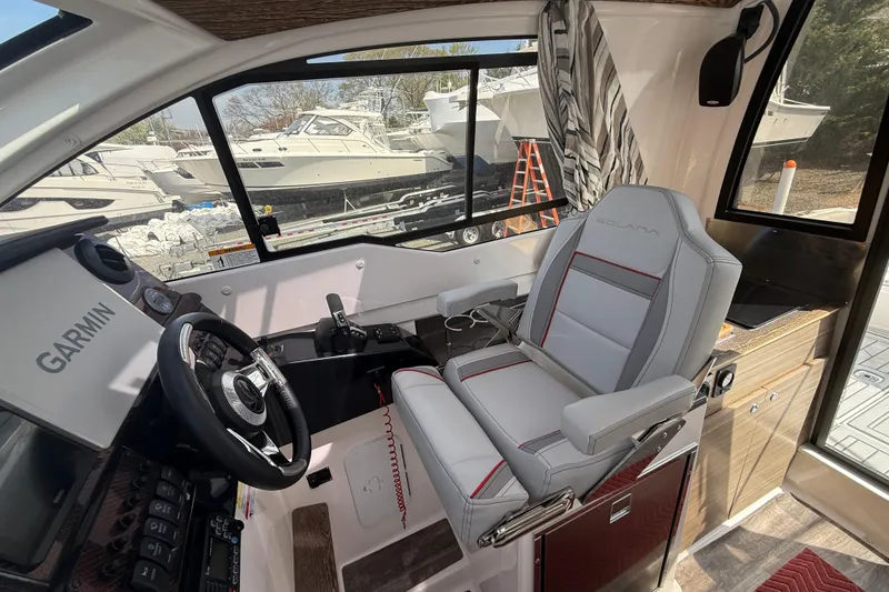 Slide: The Image of Interior of 2024 Solara S-250 Coupe boat with Garmin navigation system and luxurious seating. - 11