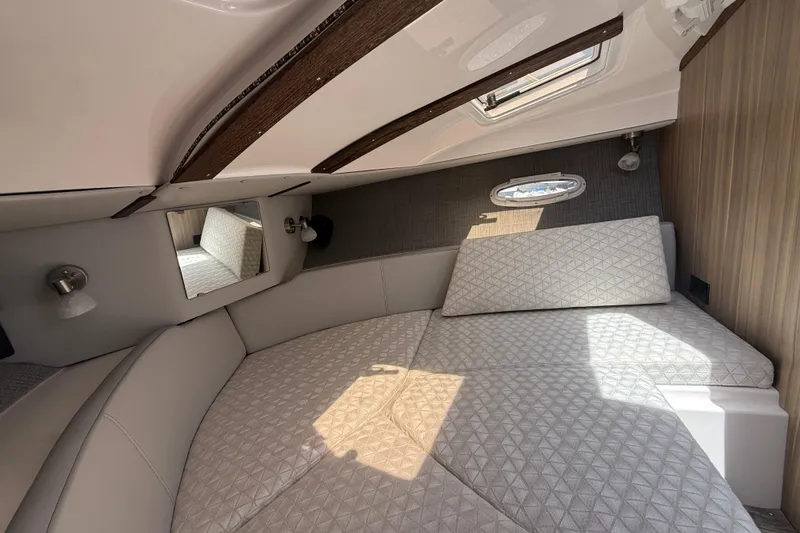 Slide: The Image of 2024 Solara S-250 Coupe cabin interior with plush bedding and modern design. - 16