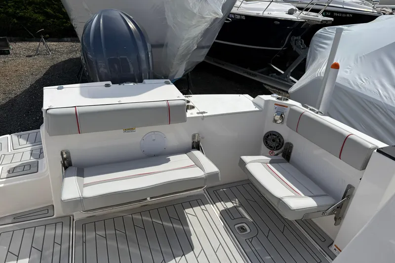 Slide: The Image of 2024 Solara S-250 Coupe boat interior with cushioned seating and sleek design. - 8