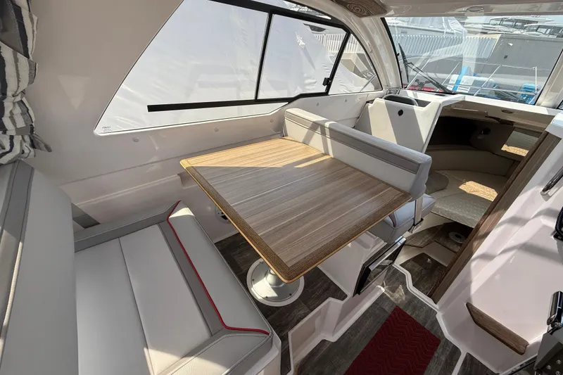 Slide: The Image of Interior of 2024 Solara S-250 Coupe, featuring a stylish dining area with wood table. - 9