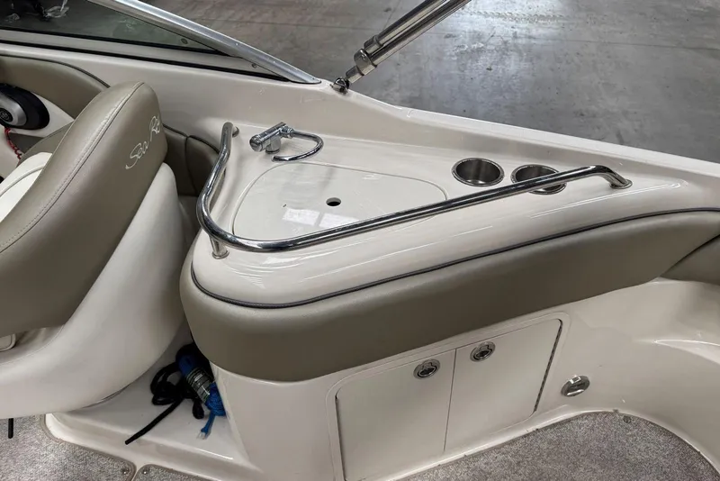 Slide: The Image of Interior view of a 2007 Sea Ray 240 Sundeck boat with seating and storage. - 13