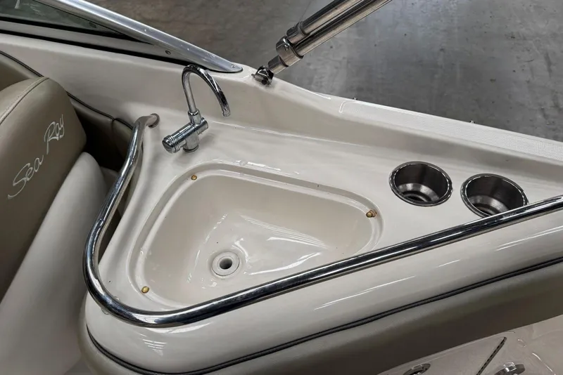 Slide: The Image of 2007 Sea Ray 240 Sundeck boat sink and cup holders detail. - 14