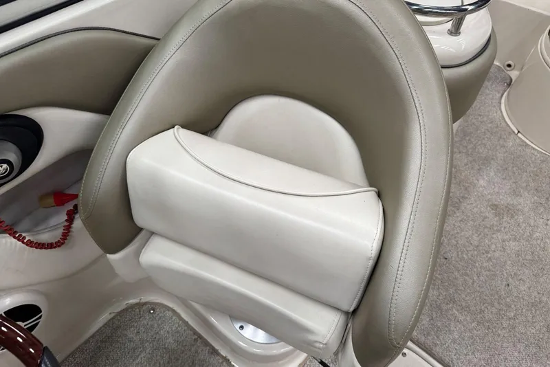 Slide: The Image of 2007 Sea Ray 240 Sundeck boat seat with beige and white upholstery. - 19