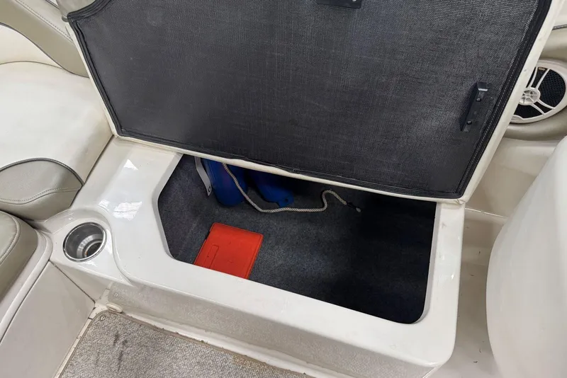 Slide: The Image of Open storage compartment on 2007 Sea Ray 240 Sundeck boat interior. - 21