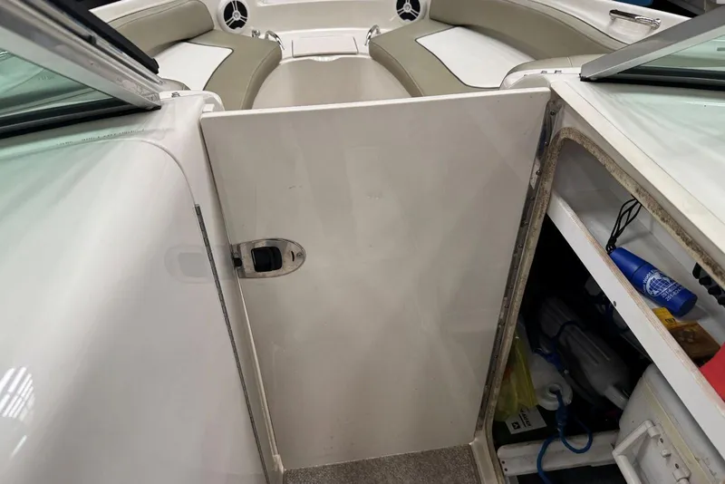 Slide: The Image of Interior view of a 2007 Sea Ray 240 Sundeck boat with storage compartment. - 24