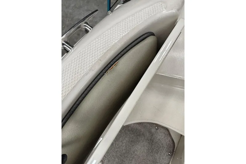 Slide: The Image of Interior detail of a 2007 Sea Ray 240 Sundeck boat, featuring seating and flooring. - 29