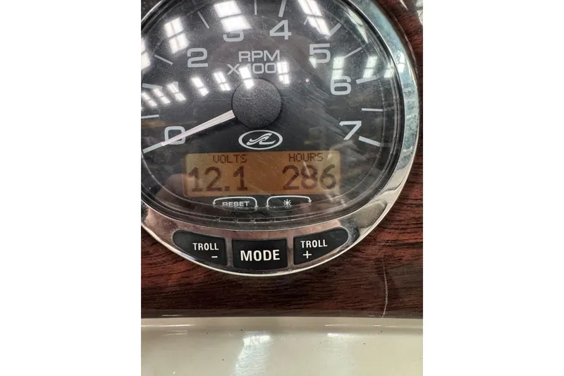 Slide: The Image of Close-up of 2007 Sea Ray 240 Sundeck gauge showing 12.1 volts and 286 hours. - 30