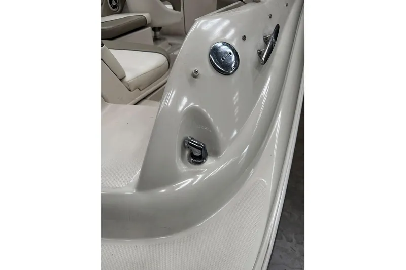 Slide: The Image of 2007 Sea Ray 240 Sundeck interior detail, showcasing seating and control panel. - 31