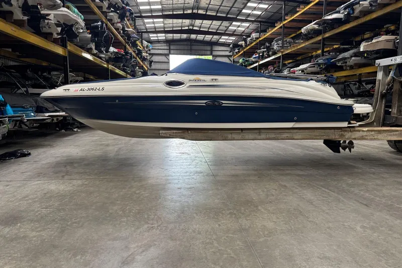 Slide: The Image of 2007 Sea Ray 240 Sundeck boat in indoor storage facility. - 36