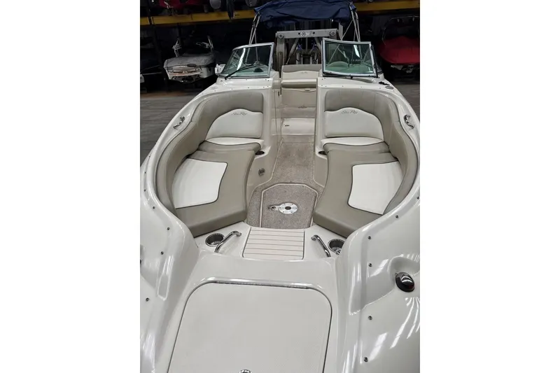 Slide: The Image of 2007 Sea Ray 240 Sundeck interior with spacious seating and elegant design. - 6