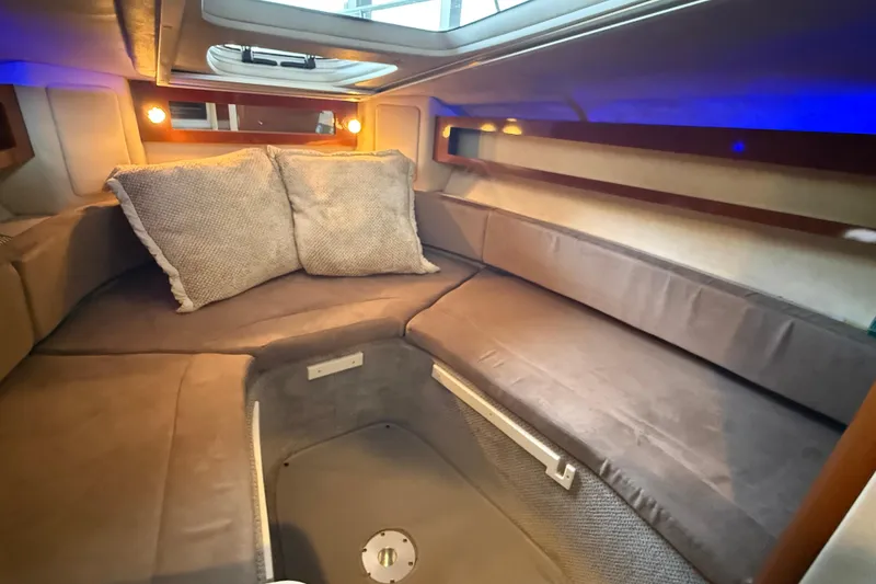 Slide: The Image of Interior cabin of 2010 Sea Ray Sundancer 280 with cozy seating and ambient lighting. - 11